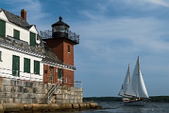 Sailboa Passes Close by Rockland Breakwater Light in Maine